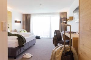 Posteľ alebo postele v izbe v ubytovaní Eden Boutique Hotel