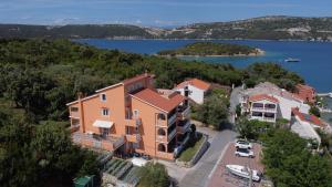 an aerial view of a house with a lake at Apartman Rab Blue in Rab