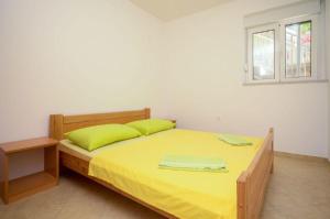 Postel nebo postele na pokoji v ubytování Apartments Ivo