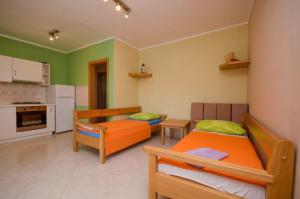 Postel nebo postele na pokoji v ubytování Apartments Ivo