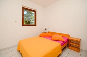 Postel nebo postele na pokoji v ubytování Apartments Ivo