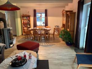 a living room with a table and a dining room at Ferienwohnung bei Kappeln an der Schlei in Kappeln