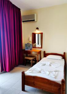 Katil atau katil-katil dalam bilik di Titania Hotel Karpathos