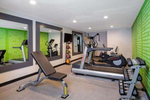a gym with two tread machines and a treadmill at La Quinta Inn & Suites by Wyndham Las Vegas Nellis in Las Vegas