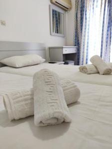 Postel nebo postele na pokoji v ubytování Atrium Apartment #1