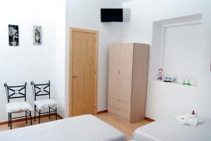 Postel nebo postele na pokoji v ubytování Hostal Batato