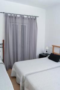 Postel nebo postele na pokoji v ubytování Hostal Batato