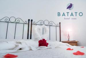 Postel nebo postele na pokoji v ubytování Hostal Batato