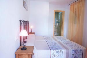 Postel nebo postele na pokoji v ubytování Hostal Batato