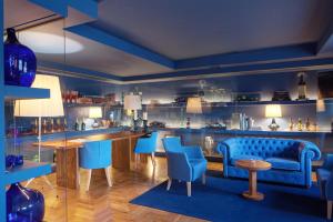 a blue bar with blue chairs and a counter at Villa Cascais Boutique Hotel in Cascais
