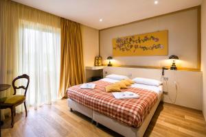 Postel nebo postele na pokoji v ubytování Umbriaverde Sporting & Resort