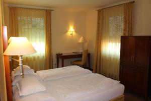 Łóżko lub łóżka w pokoju w obiekcie Hotel Nationalpark