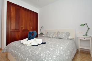Łóżko lub łóżka w pokoju w obiekcie Villa Papagyo