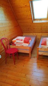 Krevet ili kreveti u jedinici u okviru objekta Domki "Pod Sumakiem"