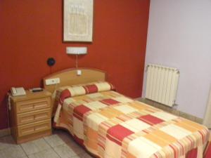 Postel nebo postele na pokoji v ubytování Hostal Las Fuentes + 4 fotografie