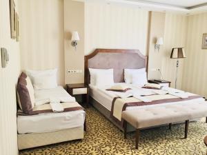 Posteľ alebo postele v izbe v ubytovaní Elixír Medical Wellness Hotel