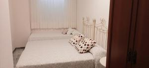 A bed or beds in a room at Apartamento Realengo Sevilla