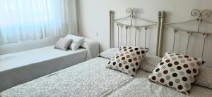 A bed or beds in a room at Apartamento Realengo Sevilla