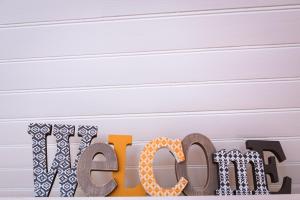 a wooden sign that says megan next to a wall at Residence Les Cimes in Font-Romeu