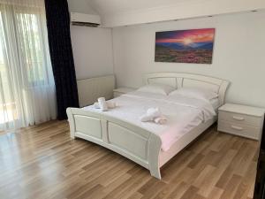 Postel nebo postele na pokoji v ubytování Vila Ann