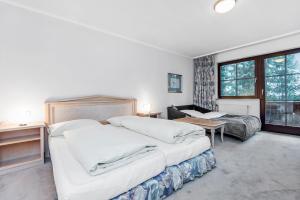 Postel nebo postele na pokoji v ubytování Heart Hotel Sylvia