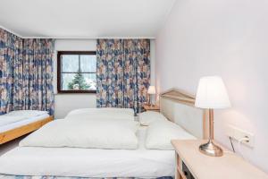 Postel nebo postele na pokoji v ubytování Heart Hotel Sylvia