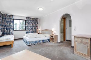 Postel nebo postele na pokoji v ubytování Heart Hotel Sylvia