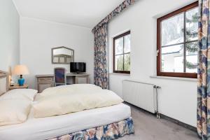 Postel nebo postele na pokoji v ubytování Heart Hotel Sylvia