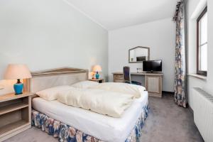 Postel nebo postele na pokoji v ubytování Heart Hotel Sylvia