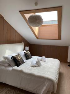 Un pat sau paturi într-o cameră la Appartement Le Mazot Vue Mont Blanc