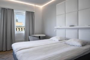 Tempat tidur dalam kamar di Omena Hotel Vaasa Espen