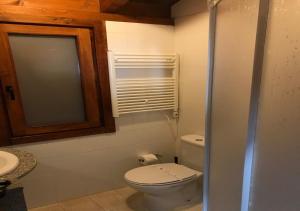 a bathroom with a toilet and a sink at Parque Biologico de Vinhais in Vinhais +97 photos