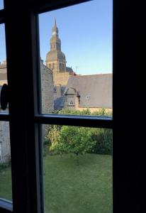 a view from an open window of a building at Perlépampille in Dinan