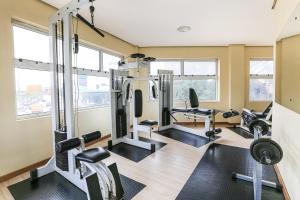 a gym with treadmills and cardio equipment in a building at Hotel Express Aeroporto in Porto Alegre
