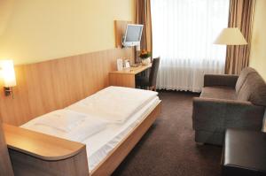 Postel nebo postele na pokoji v ubytování Hotel Fortuna