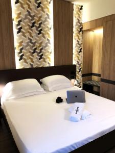 Postel nebo postele na pokoji v ubytování Hotel Ombra