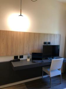 TV a/nebo společenská místnost v ubytování Hotel Ombra