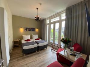 Postel nebo postele na pokoji v ubytování Alp Hotel