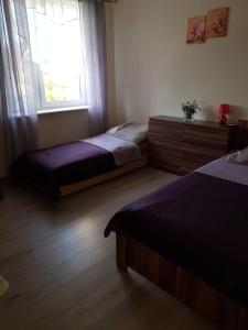 Postel nebo postele na pokoji v ubytování Zacisze 6