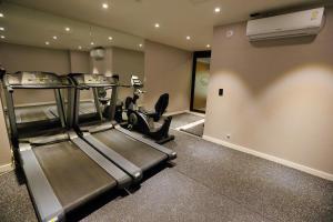 a room with a gym with a treadmill and a treadmill at Forest 701 Hotel in Daegu