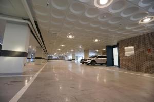 an empty parking garage with a car parked in it at Forest 701 Hotel in Daegu