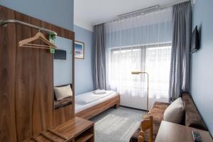 Postel nebo postele na pokoji v ubytování Alper Hotel am Potsdamer Platz