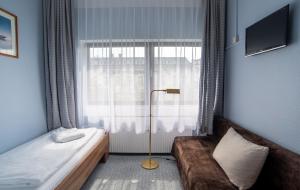Postel nebo postele na pokoji v ubytování Alper Hotel am Potsdamer Platz