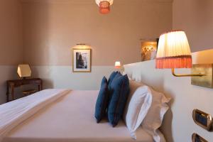 Ein Bett oder Betten in einem Zimmer der Unterkunft Palazzo Colombo