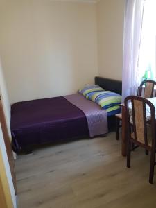 Postel nebo postele na pokoji v ubytování Zacisze 6