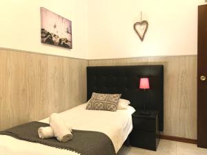 Posteľ alebo postele v izbe v ubytovaní La Pedrera Residence