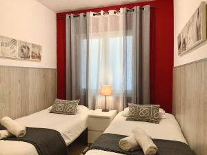 Posteľ alebo postele v izbe v ubytovaní La Pedrera Residence