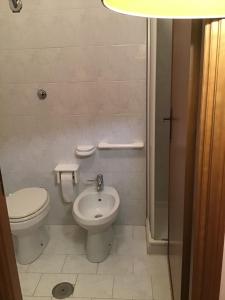 a bathroom with a toilet and a sink at Alloggio turistico Luigina in Morro Reatino