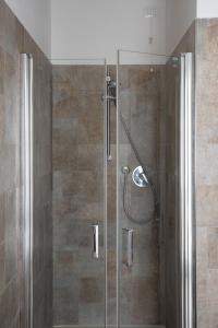 a shower with a glass door in a bathroom at B&B Al Piovego in Noventa Padovana +36 photos