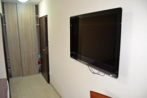 A television and/or entertainment centre at Reštaurácia-penzión ALTANA
